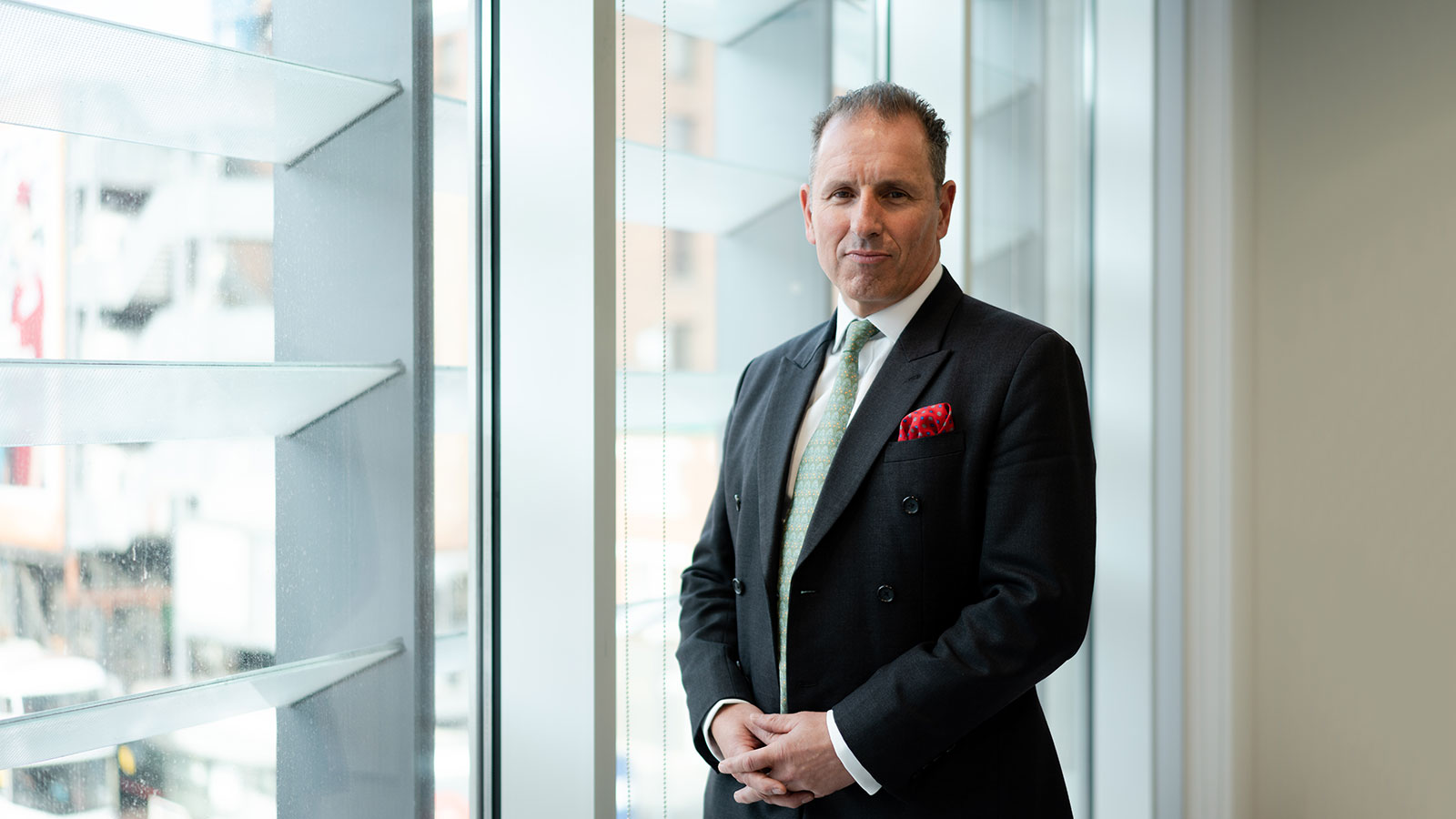 Managing Director and Founding Partner Robert Hanna standing and posing for photo in Augusta London office.