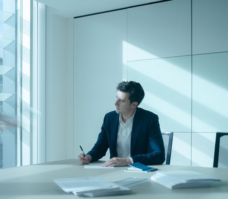 Diligence Investment Manager and solicitor David Walker working in Augusta London office boardroom