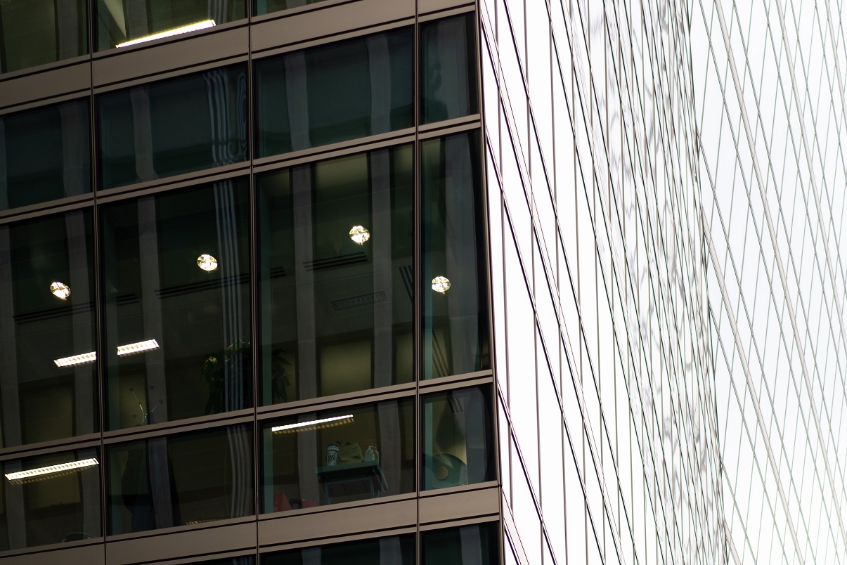 close exterior view of modern glass office building during the day