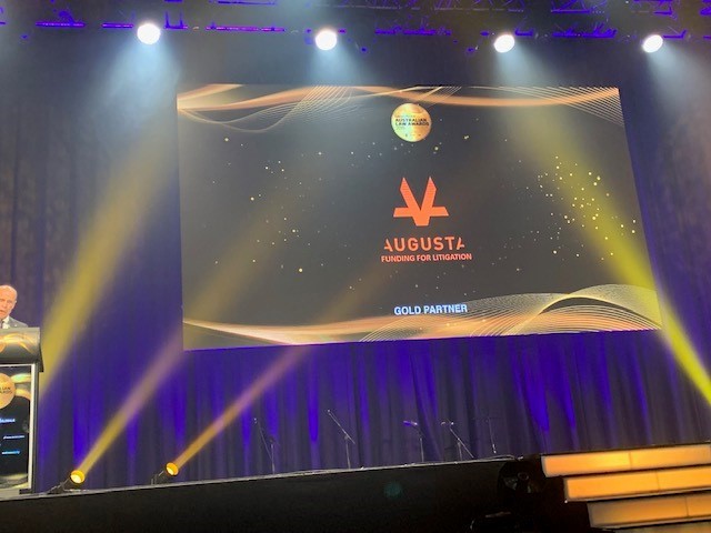 Stage and projection at awards show with Augusta Logo in the centre